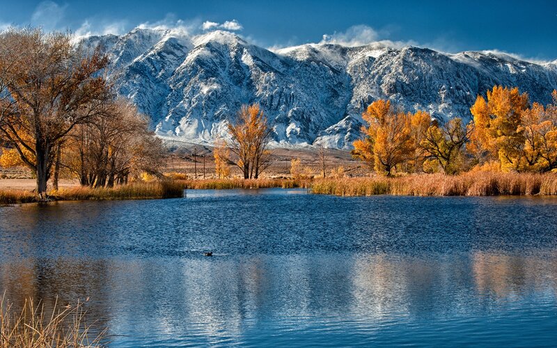 Autumn lake with snow-capped mountains