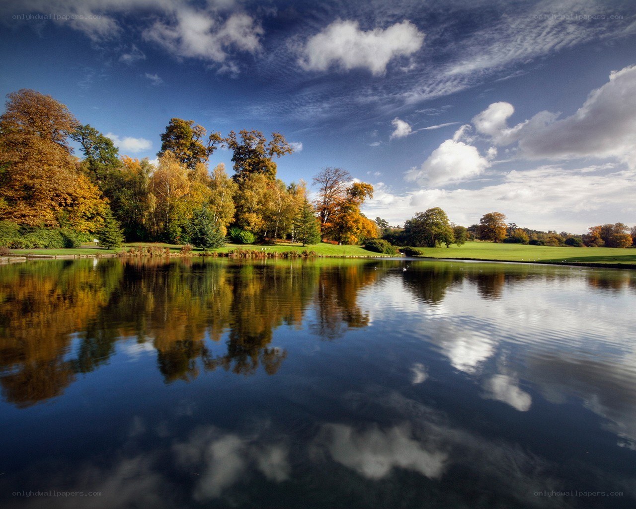 Autumn lake with tree reflections