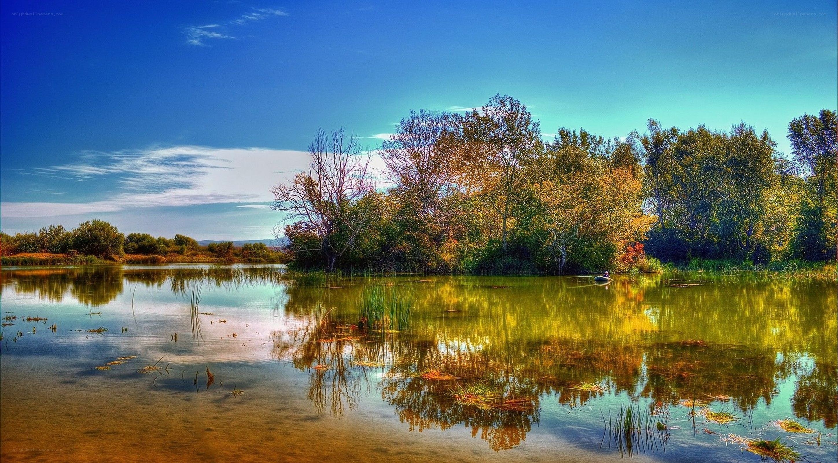 Autumn lake with tree reflections