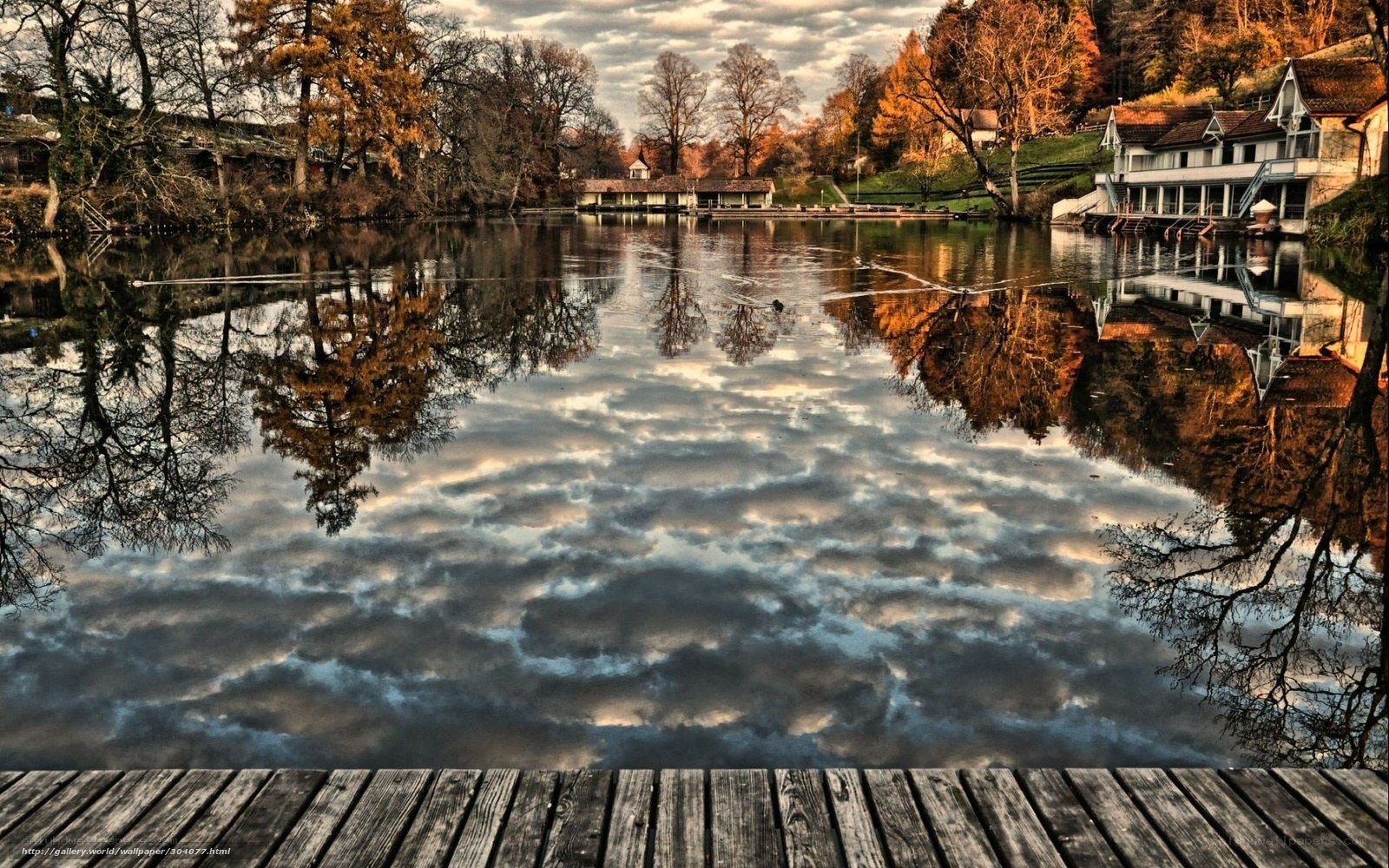 Autumn lake with wooden dock
