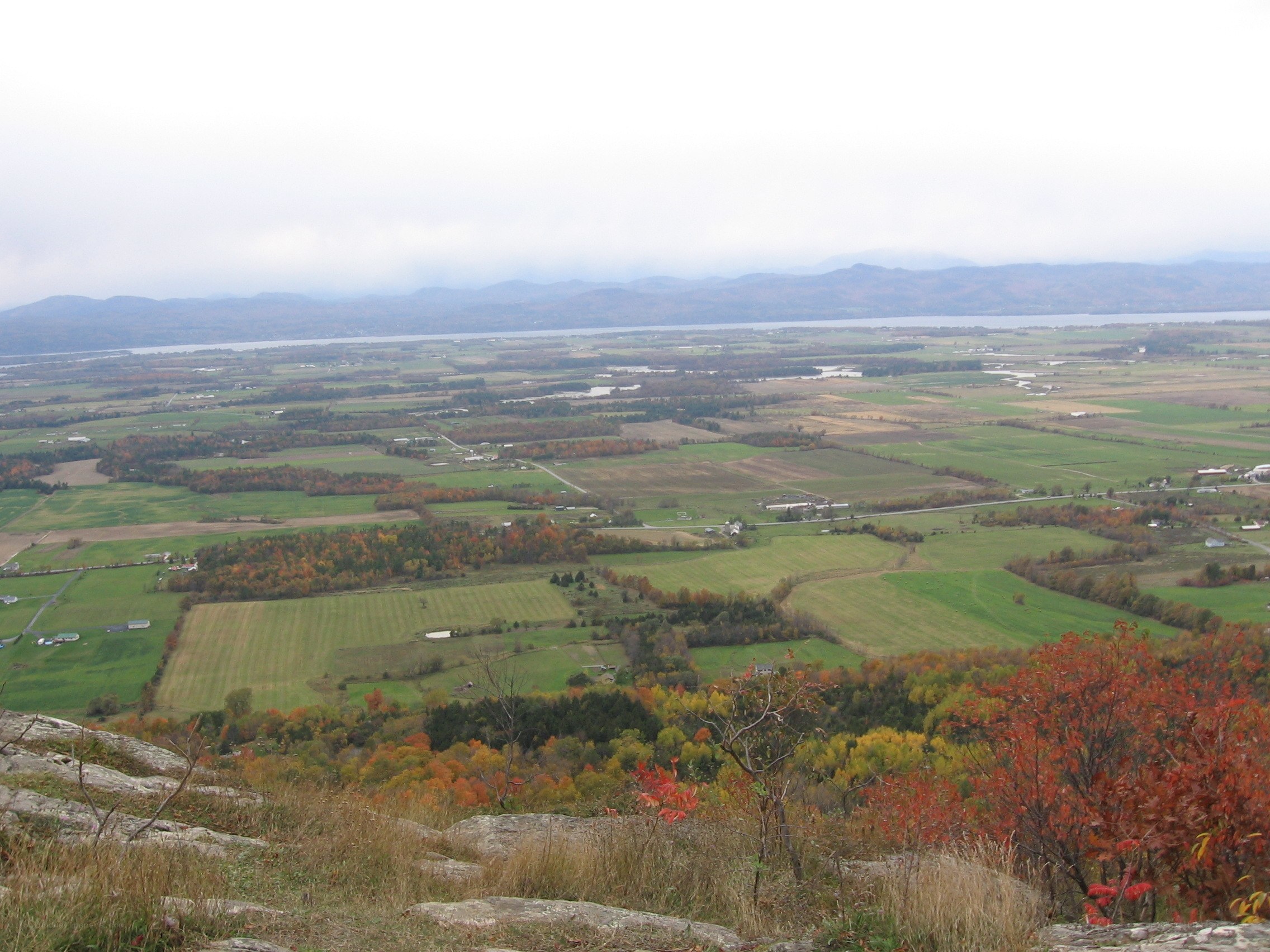 autumn landscape with lake and fields
