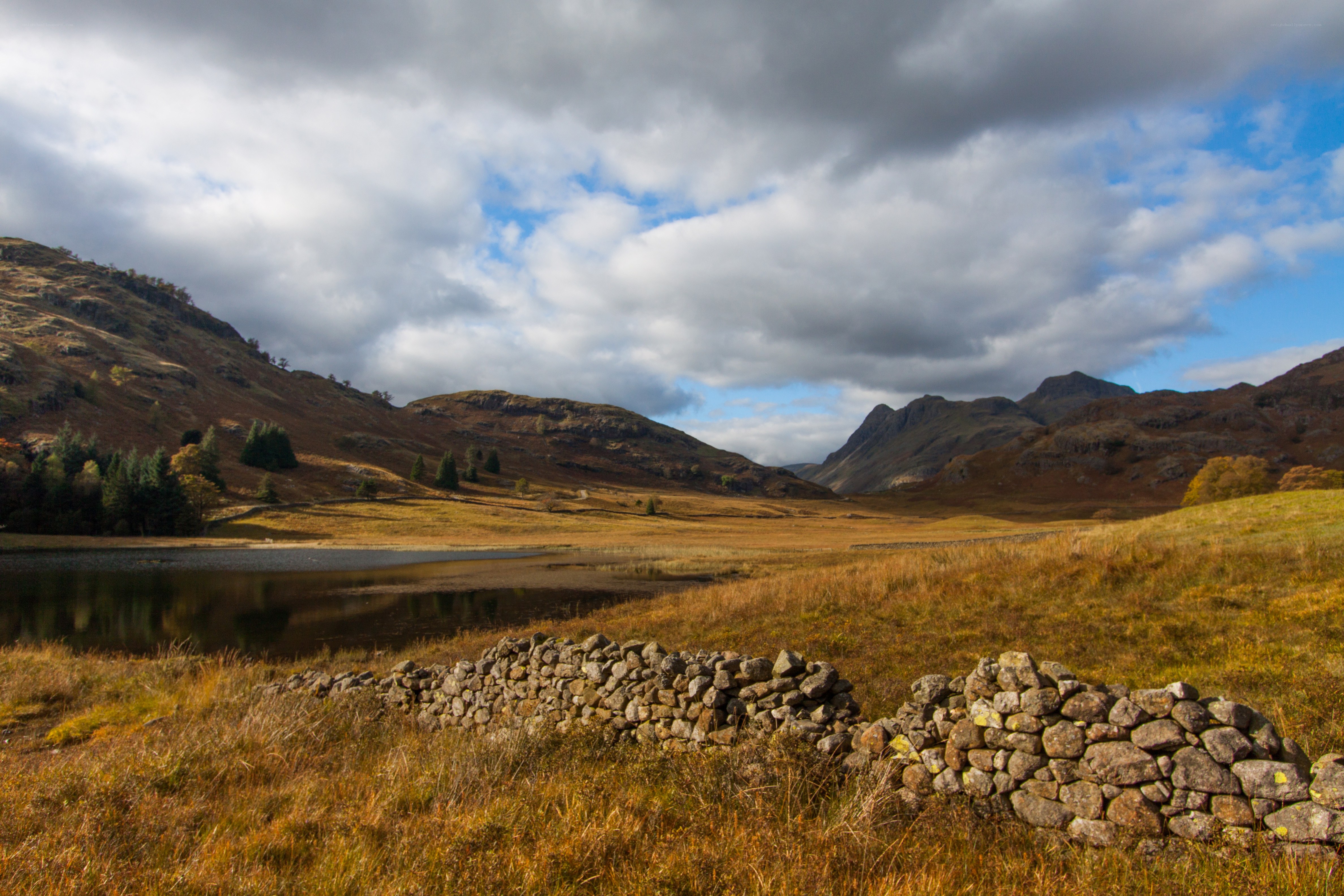 Autumn landscape with lake and mountains