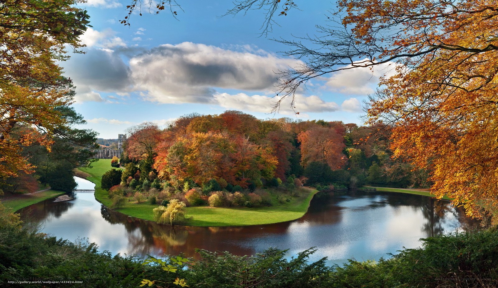 Autumn landscape with river and abbey