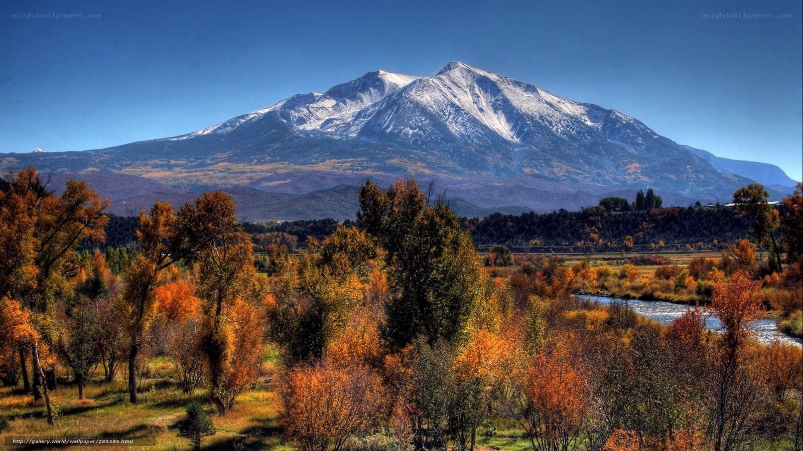 Autumn landscape with snow-capped mountain