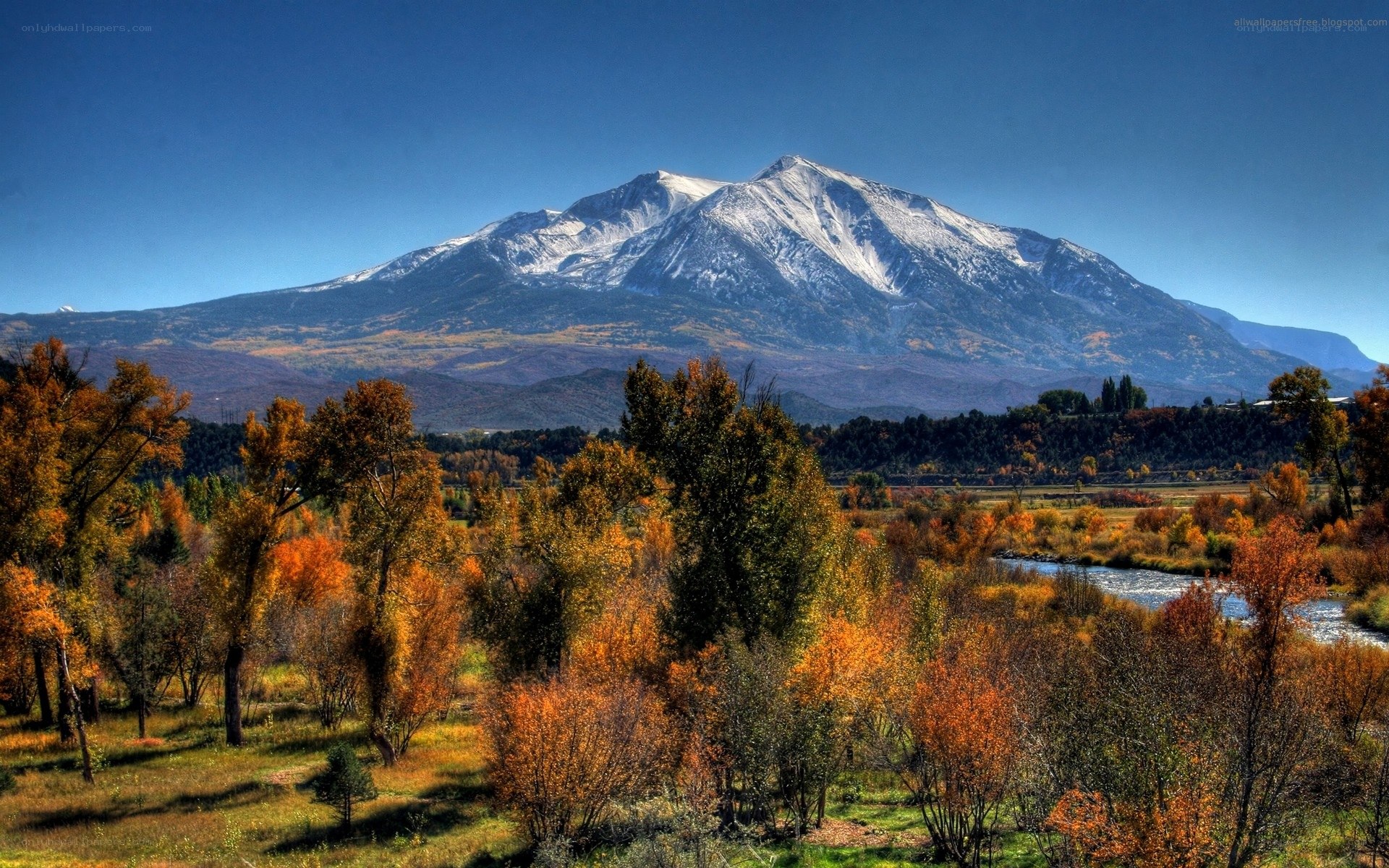 Autumn landscape with snow-capped mountain
