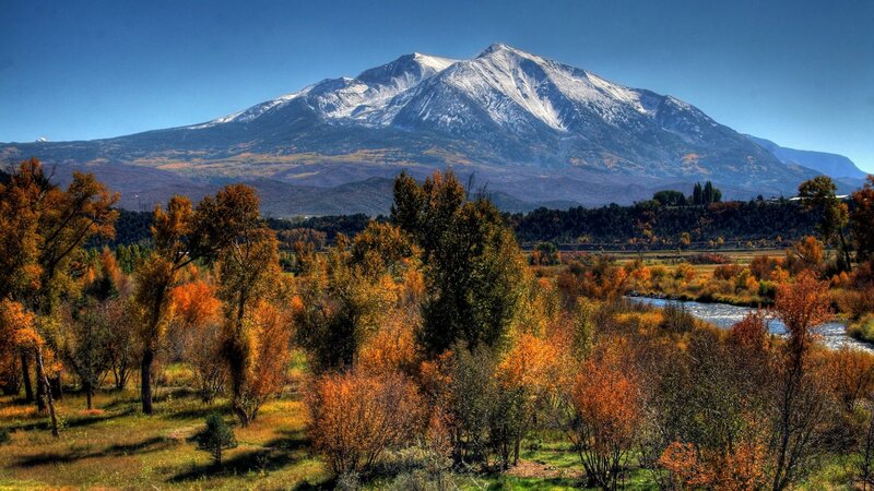 Autumn landscape with snow-capped mountain