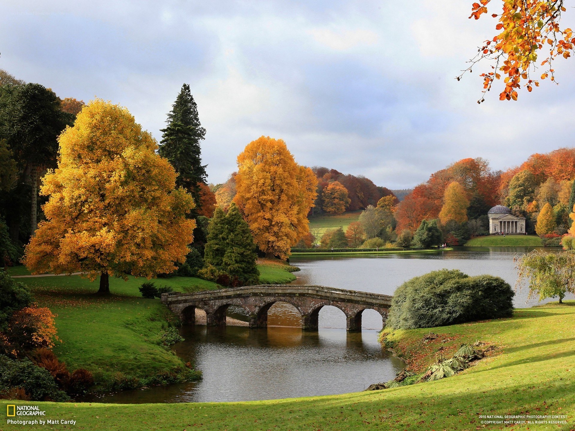 Autumn landscape with stone bridge