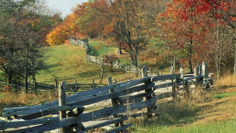 Autumn landscape with wooden fence