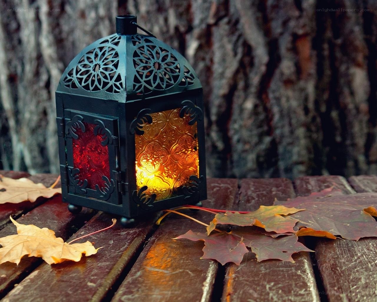 Autumn lantern on wooden table