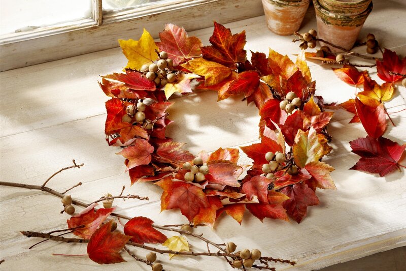 Autumn leaf wreath on windowsill