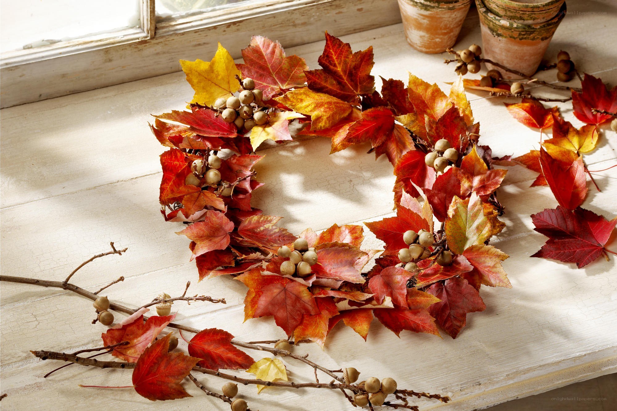 Autumn leaf wreath on windowsill