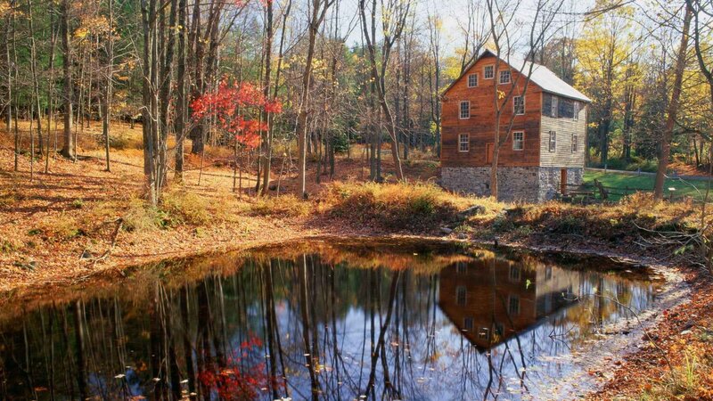 Autumn mill by a pond