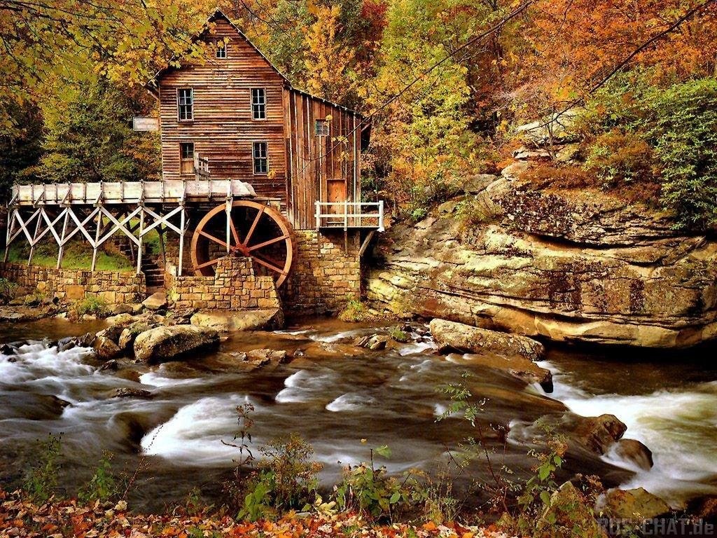 Autumn mill by a river
