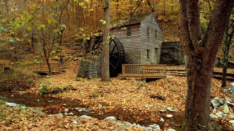 Autumn mill by a stream