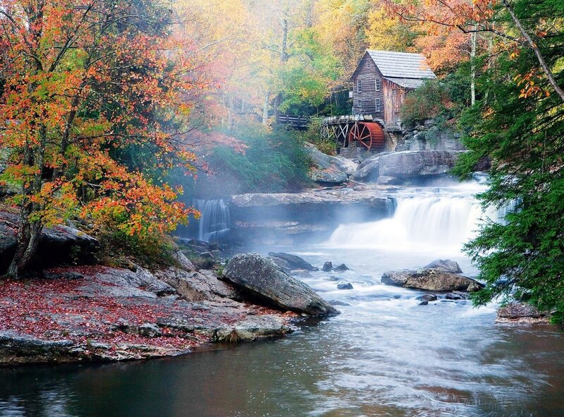 Autumn mill by a waterfall