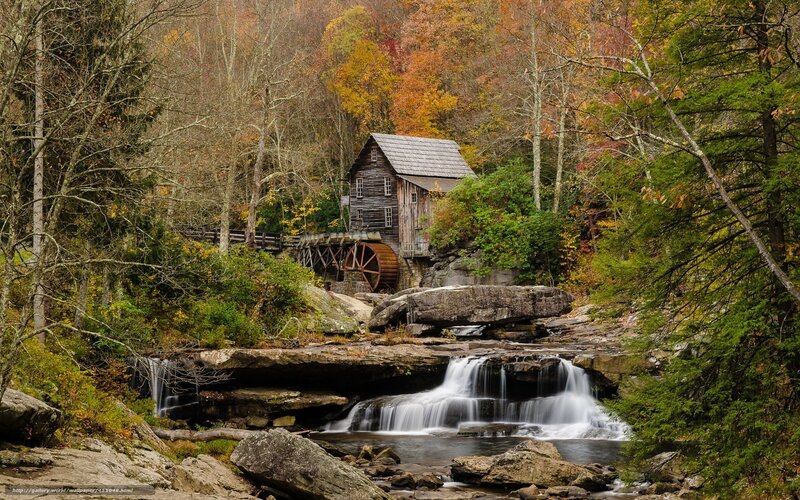 Autumn mill by a waterfall