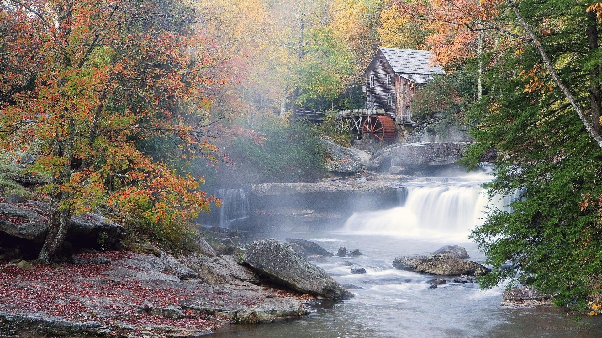 autumn mill by a waterfall