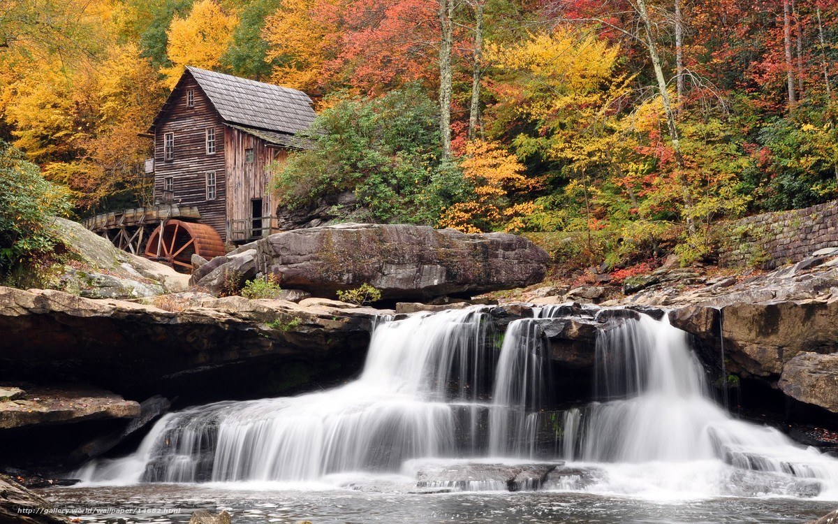 Autumn mill by a waterfall