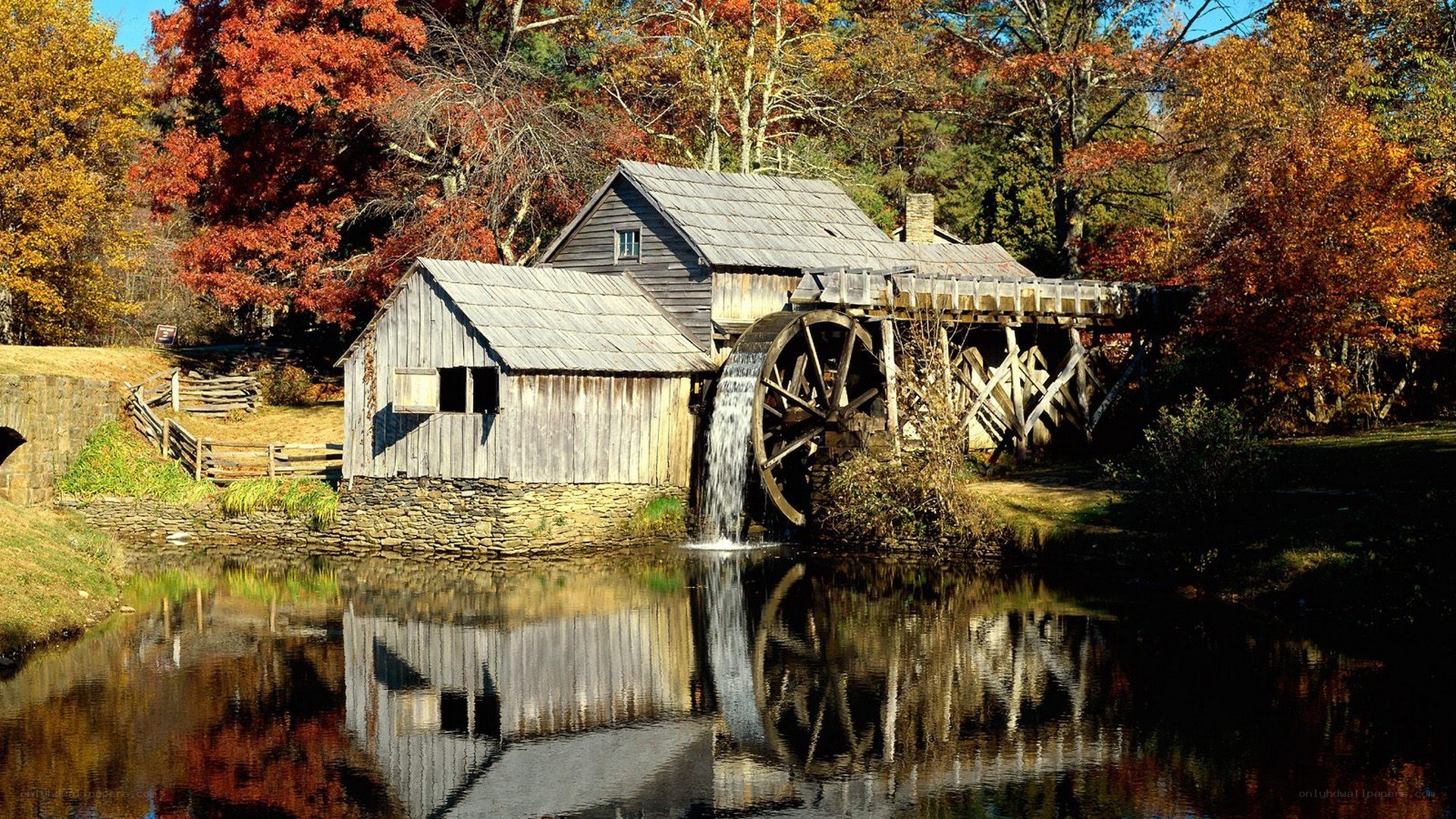 Autumn mill by the river