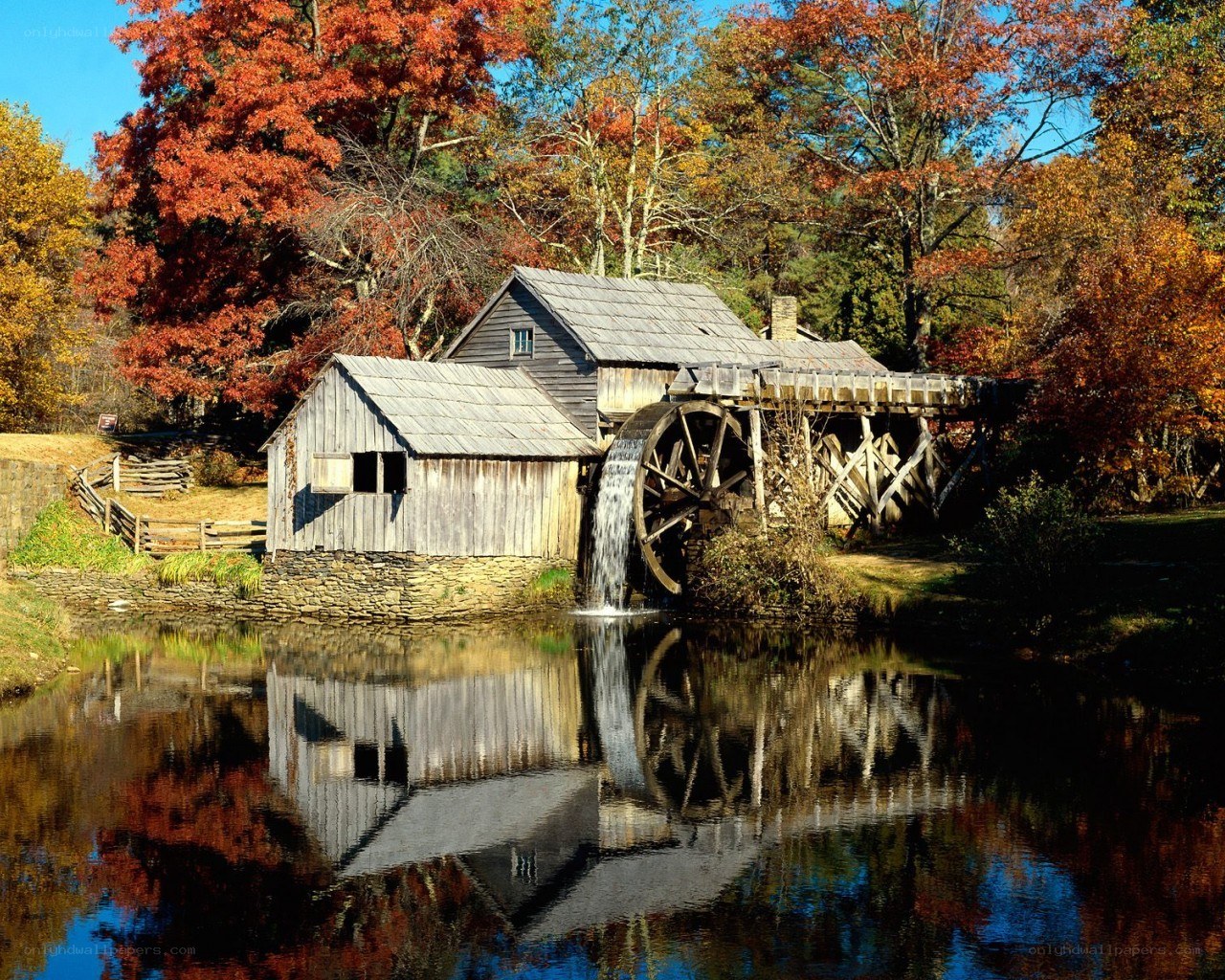 Autumn mill by the river