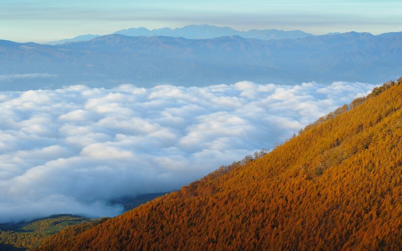 Autumn mountain landscape with sea of clouds
