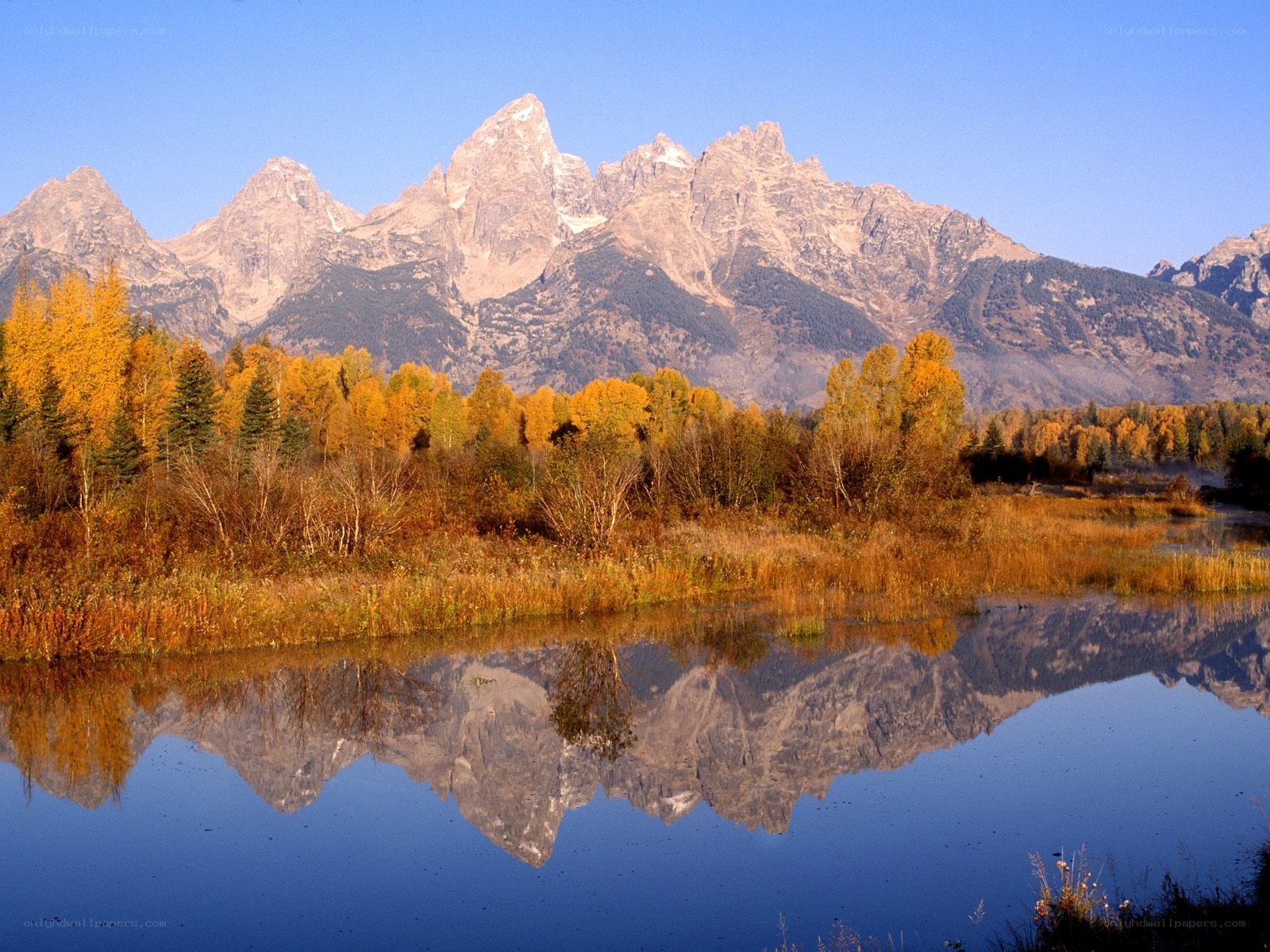 Autumn mountains reflected in a lake