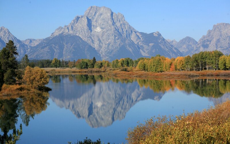 Autumn mountains reflected in a lake