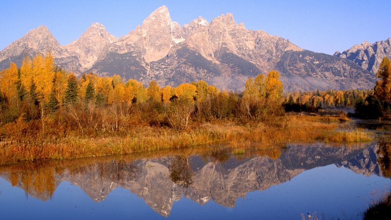 Autumn mountains reflected in a lake