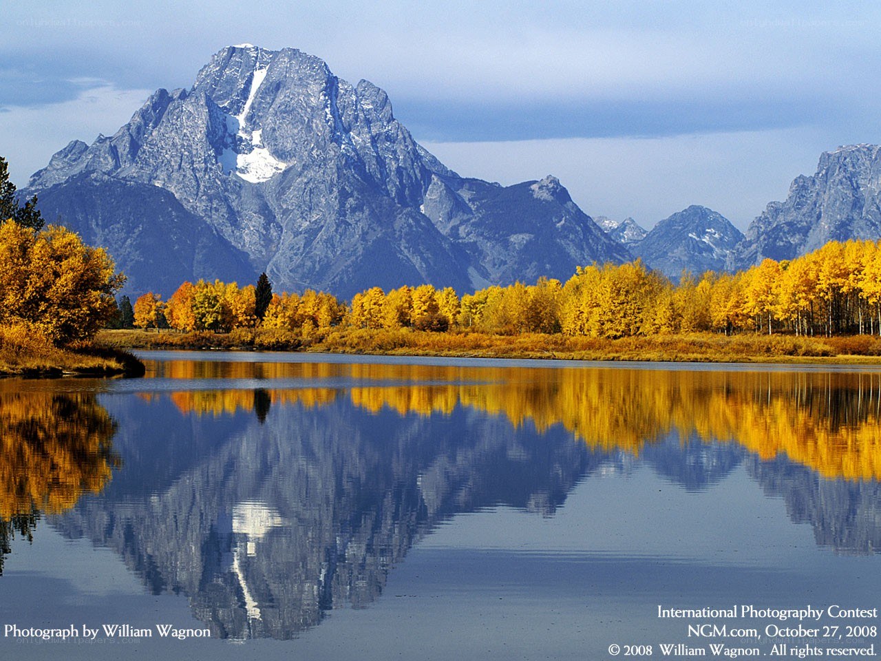 Autumn mountains reflected in a lake