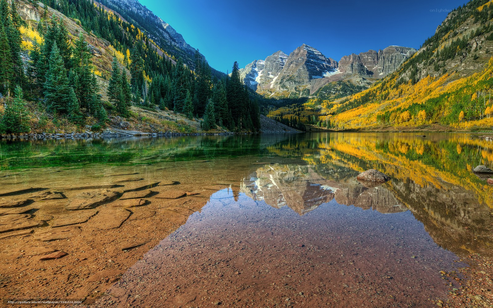 Autumn mountains reflected in a lake