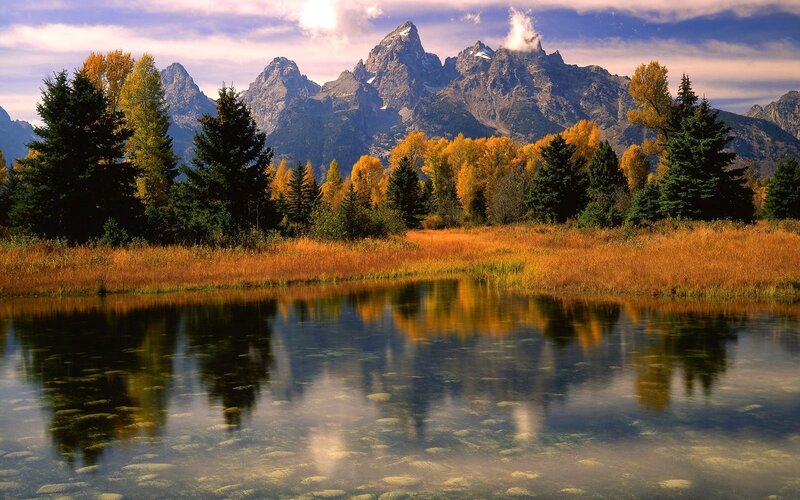 Autumn mountains reflected in a pond