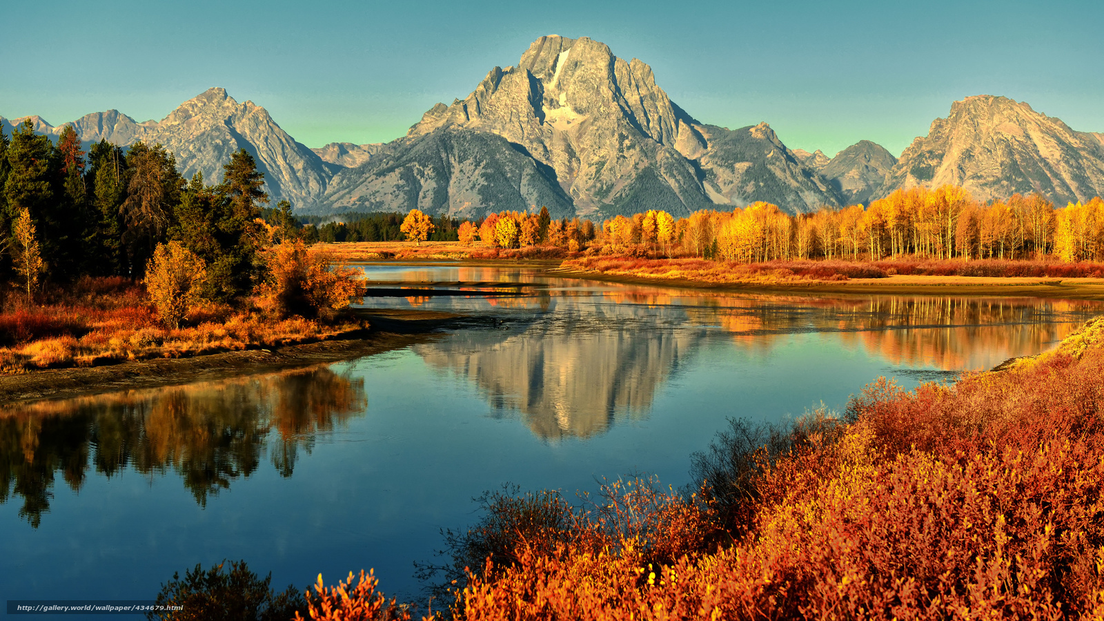 Autumn mountains reflected in a river