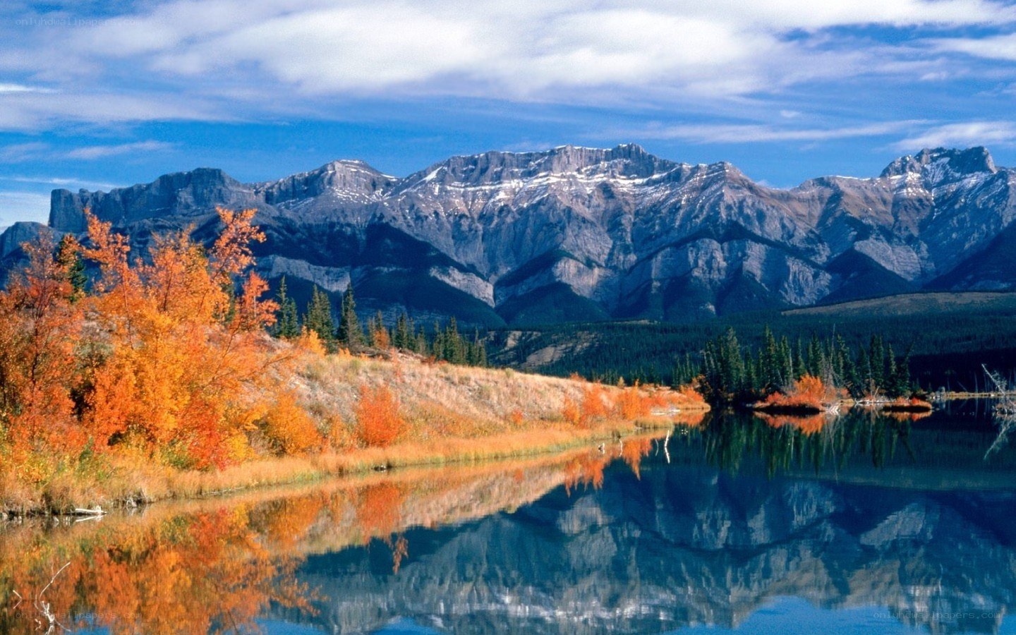 Autumn mountains reflected in lake