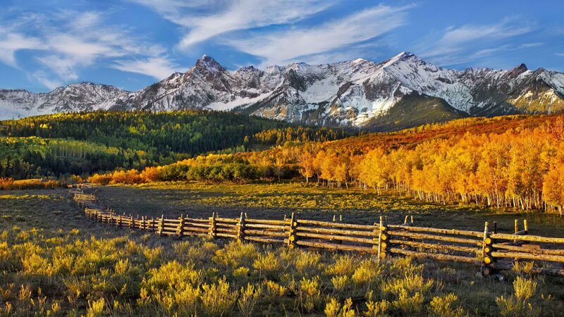 Autumn mountains with wooden fence