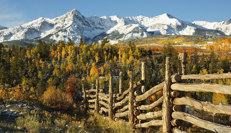 Autumn mountains with wooden fence