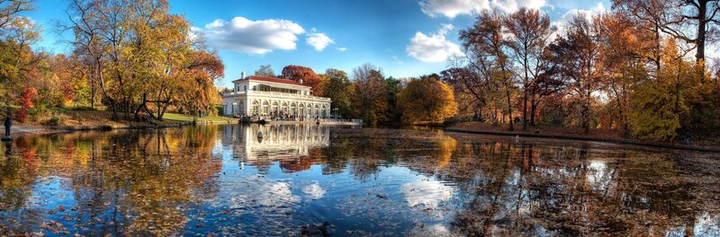 Autumn park with lake and pavilion