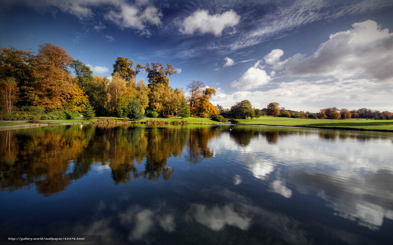 Autumn park with lake reflection