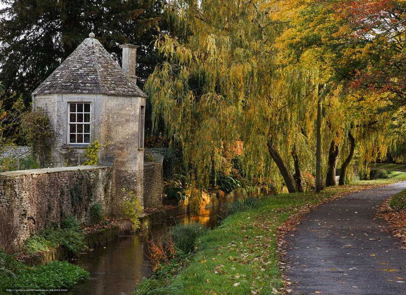 Autumn path by stone tower