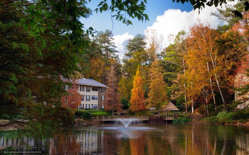 Autumn pond with fountain and gazebo