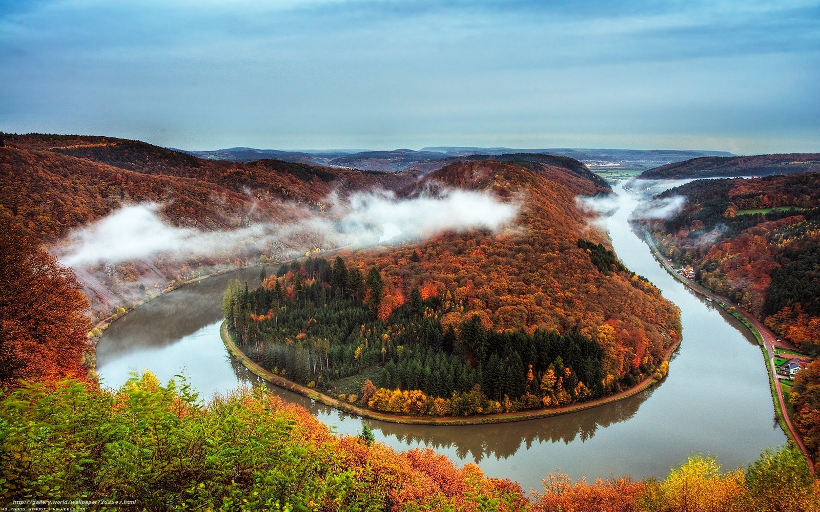 Autumn river bend with fog