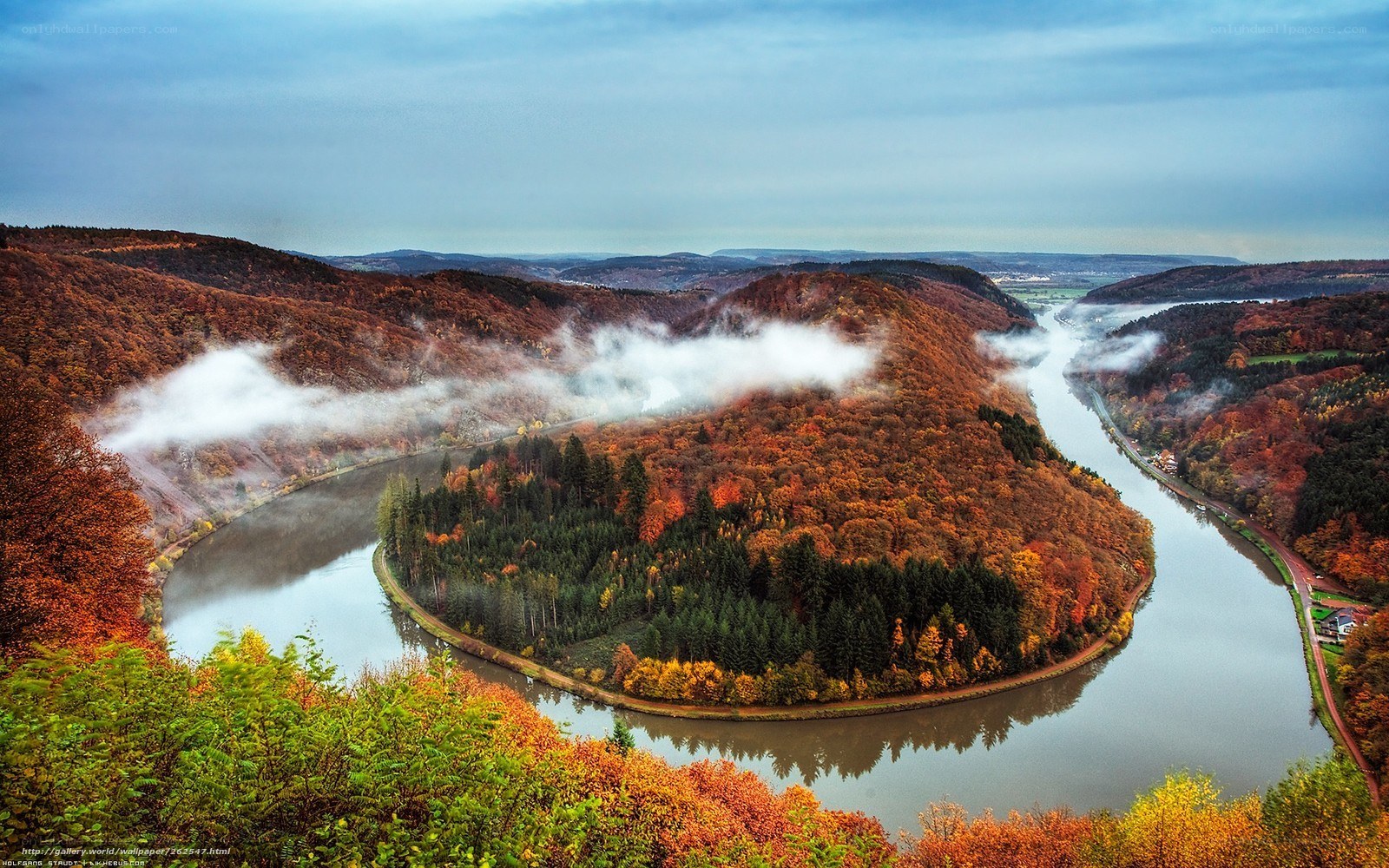 Autumn river bend with fog