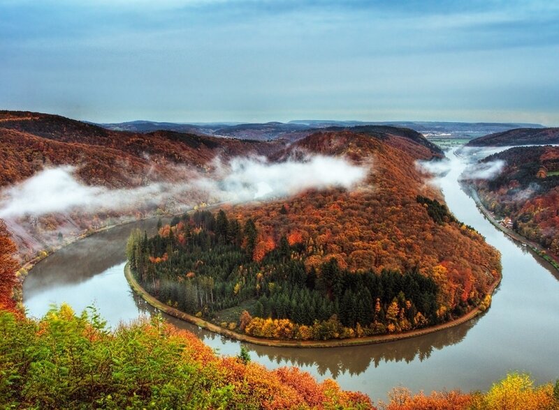 autumn river bend with mist
