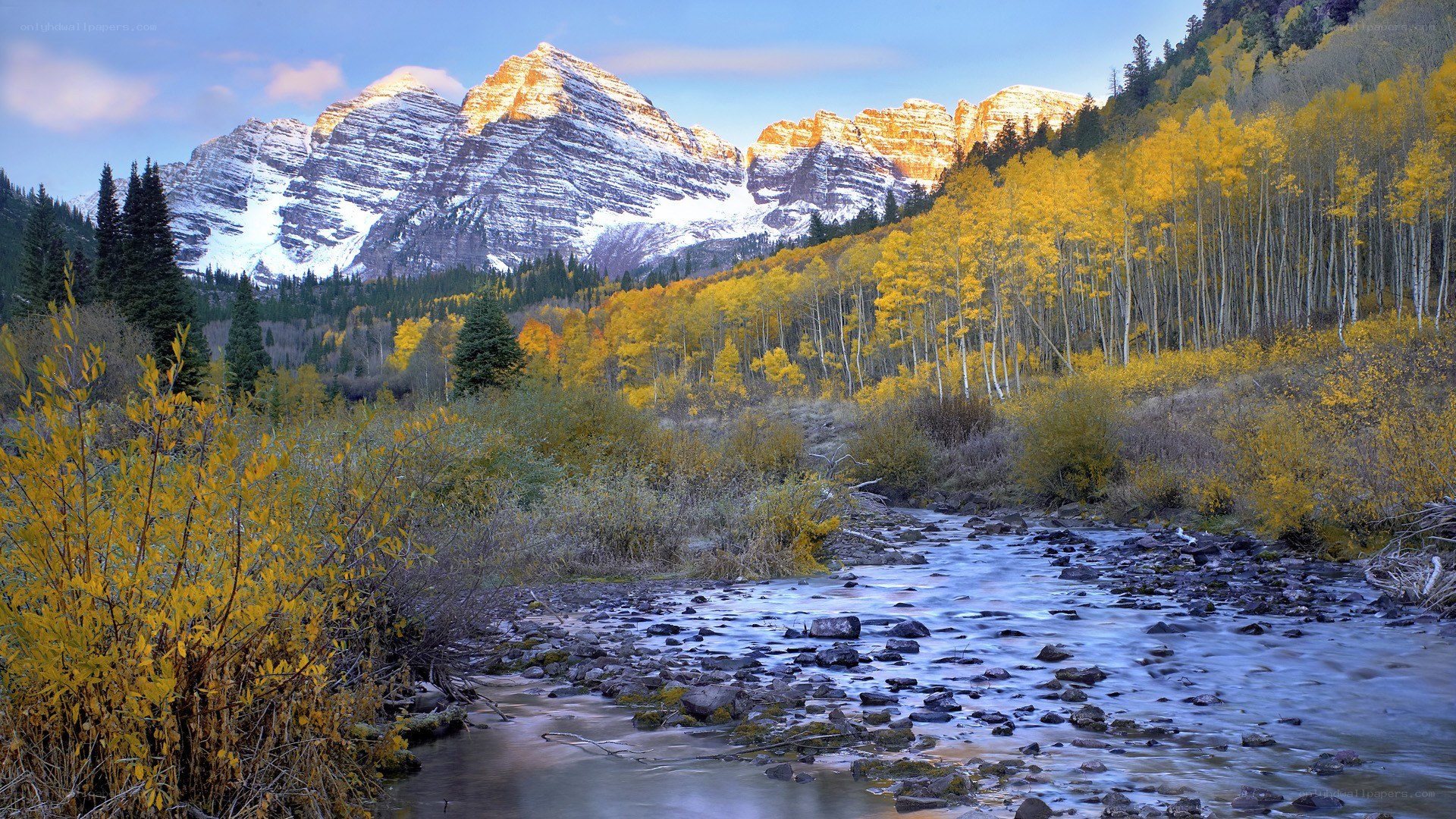 Autumn river in mountain valley