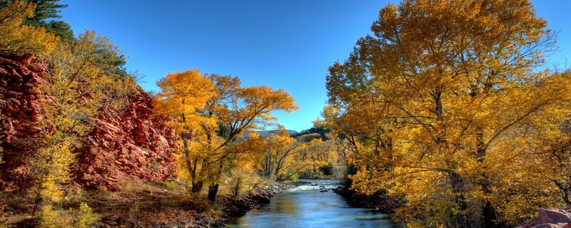 Autumn river in red rock canyon