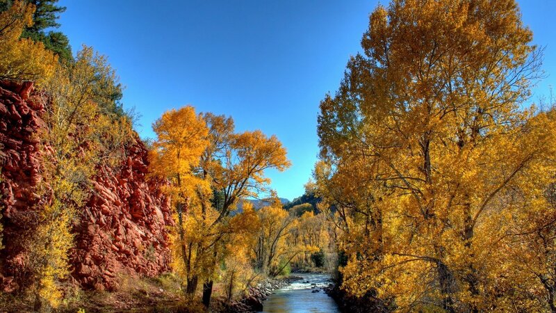 Autumn river in red rock canyon