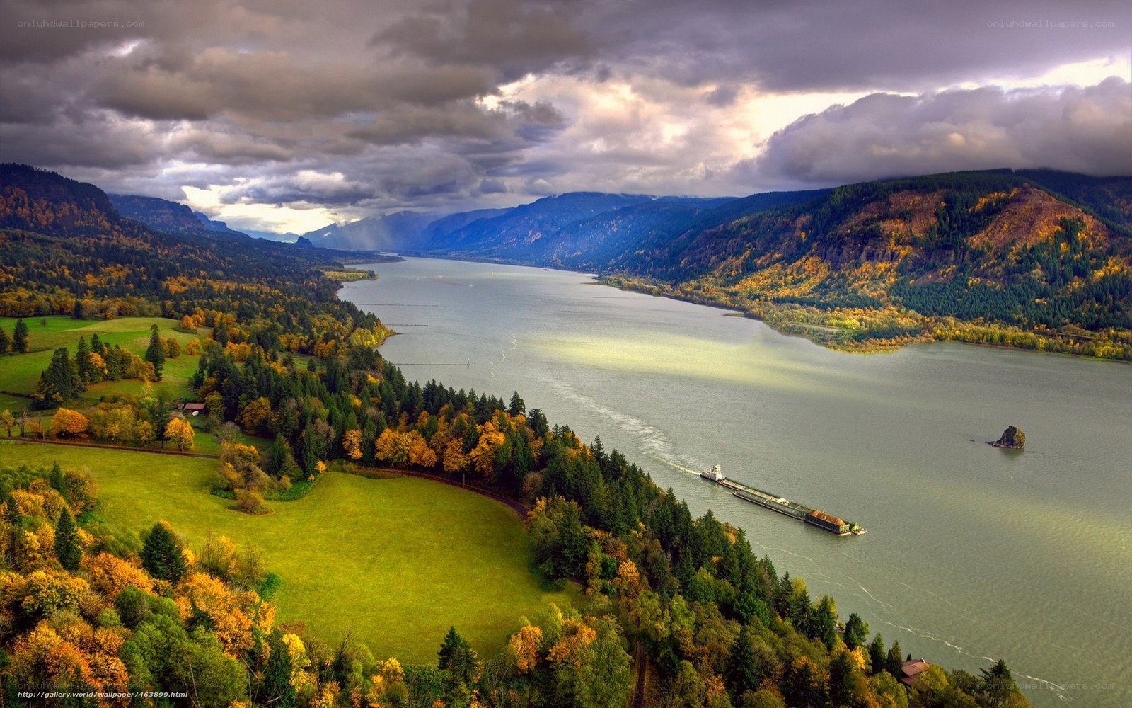 Autumn river landscape with barge