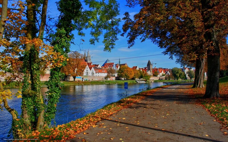 Autumn river path in a European town