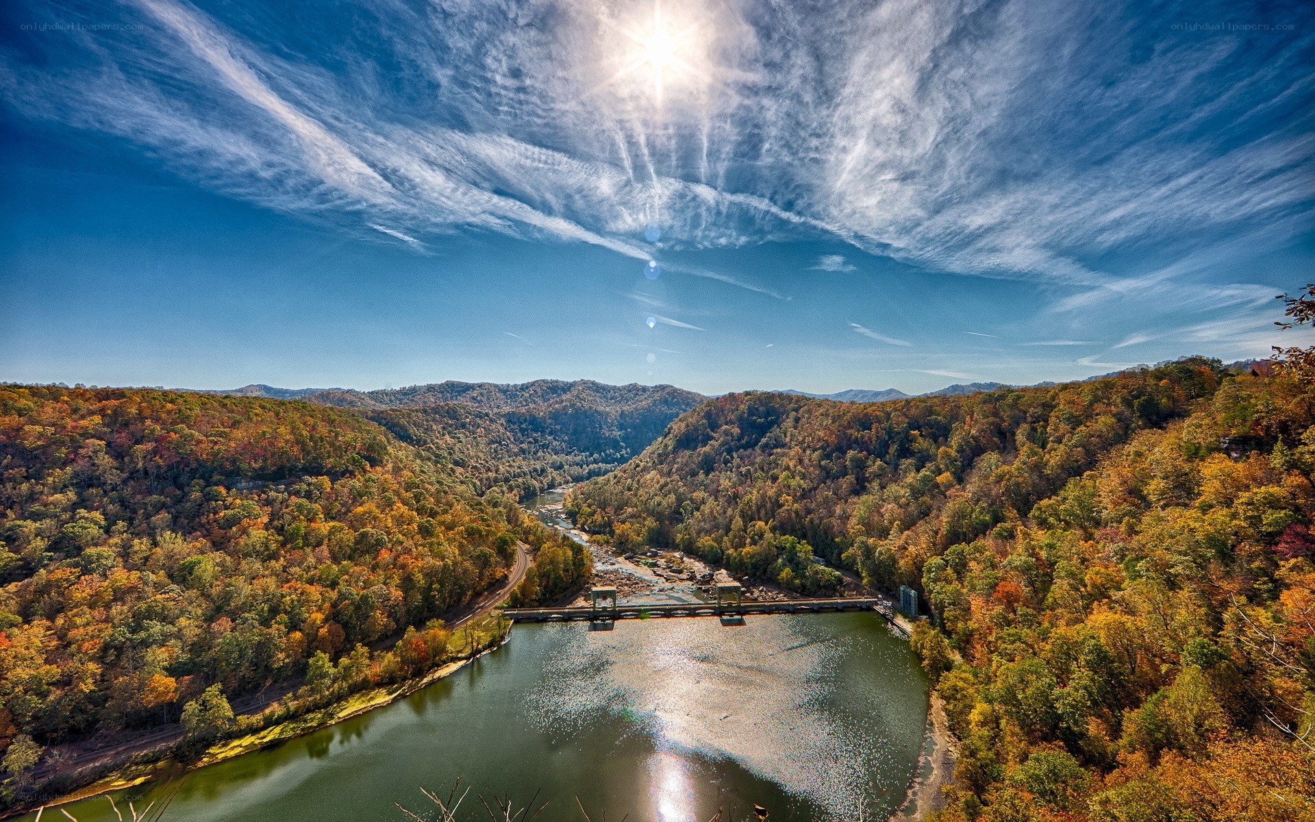 Autumn river valley with dam