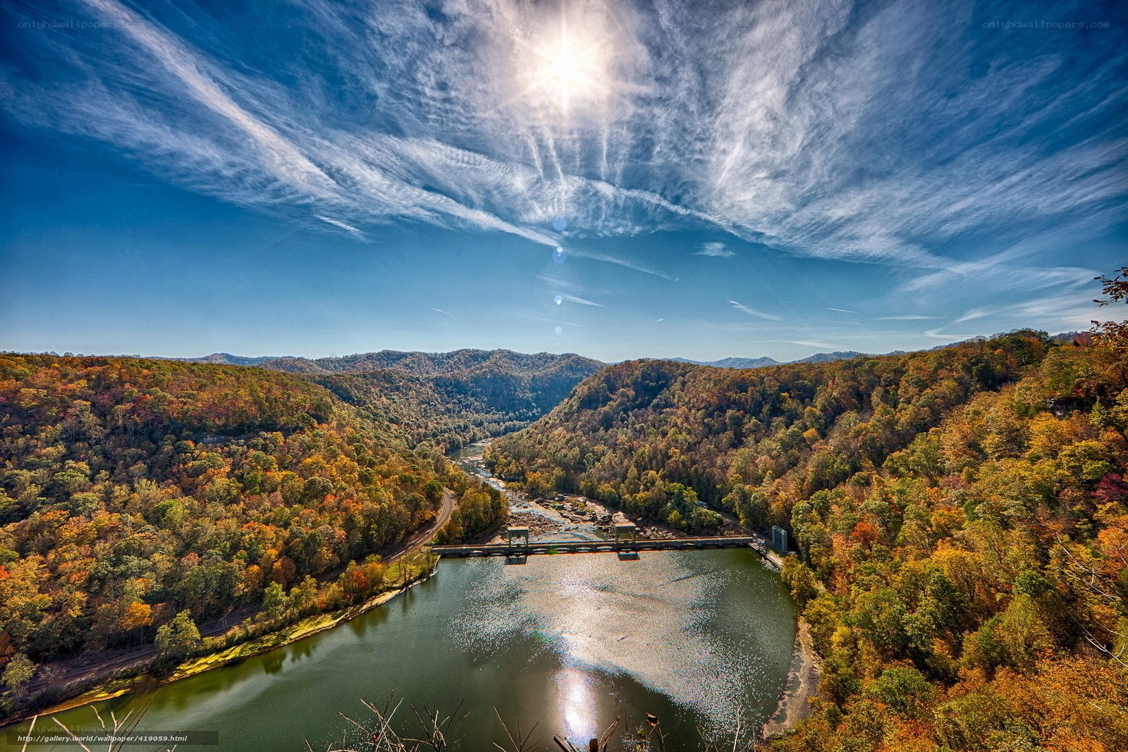 Autumn river valley with dam