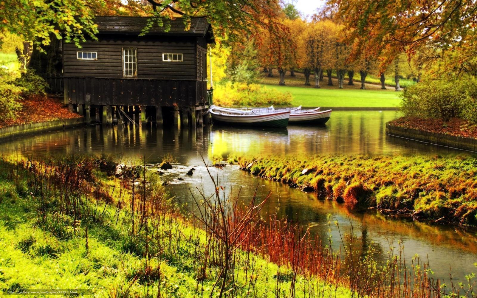 Autumn river with boathouse